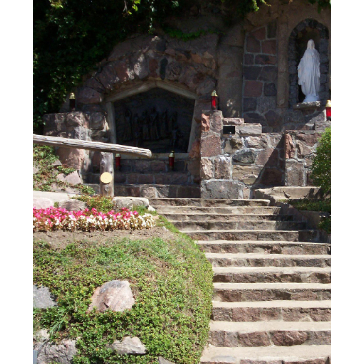 Martyrs Shrine Lourdes Grotto  with steps to a small area to kneel and pray