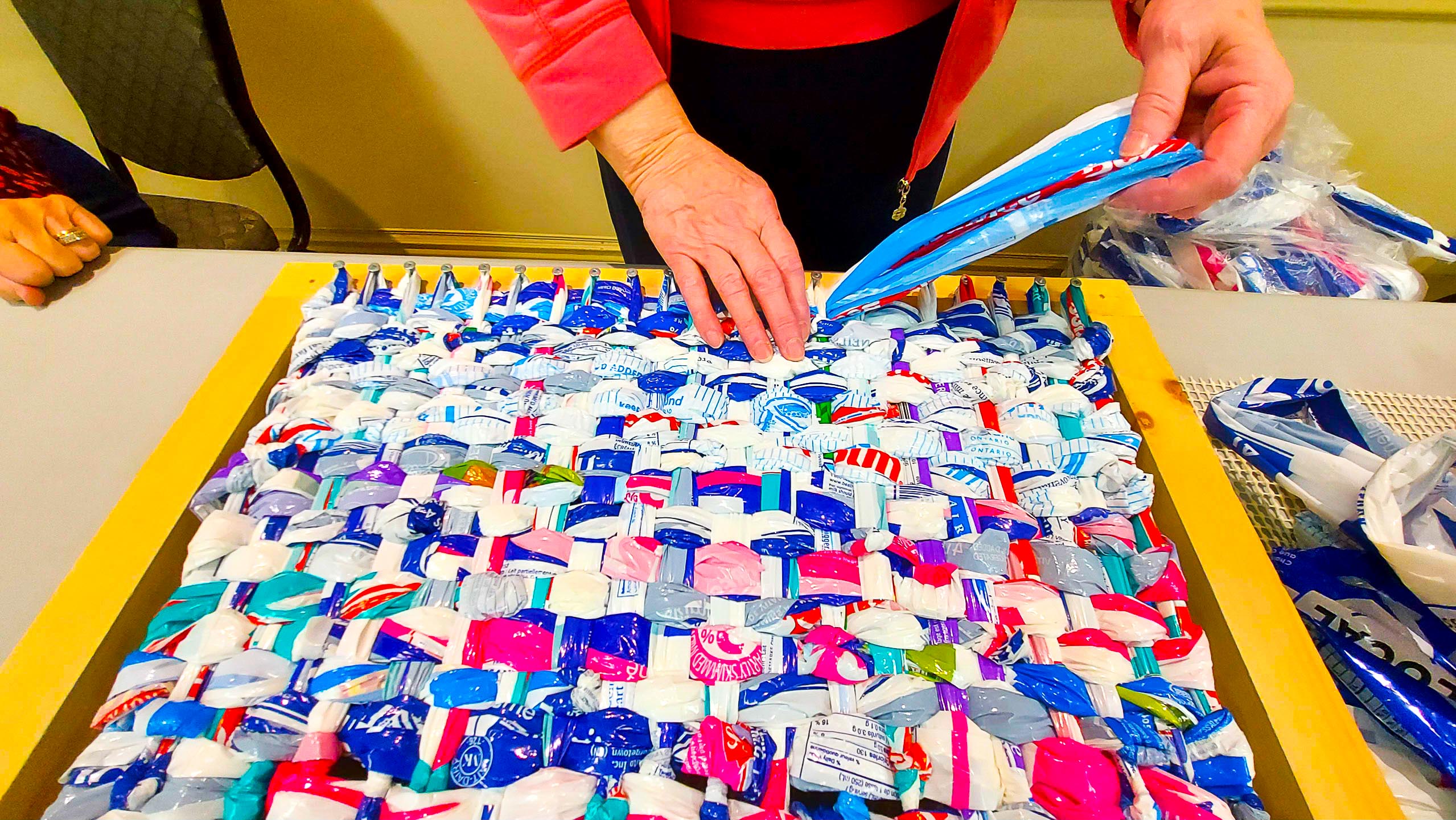 Milk Bags being woven into mats