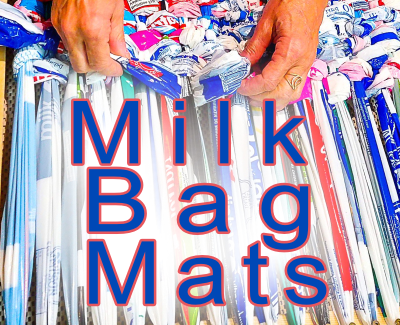 Milk bag mats showing hands weaving a mat from plastic milk bags